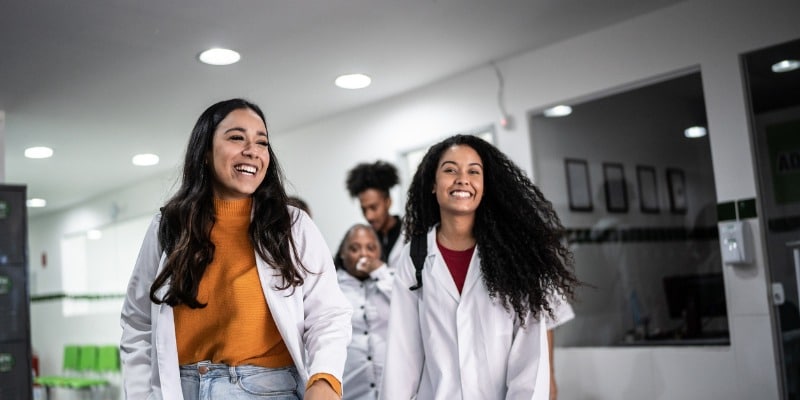 Medical Students walking through school - Joining the Healthcare Industry: A Guide for New Canadians & Permanent Residents