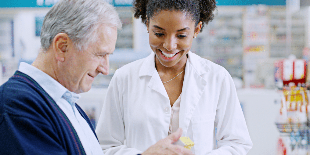 Pharmacy Assistant helping patient with medication directions - How to Become a Pharmacy Assistant: 5 Steps 